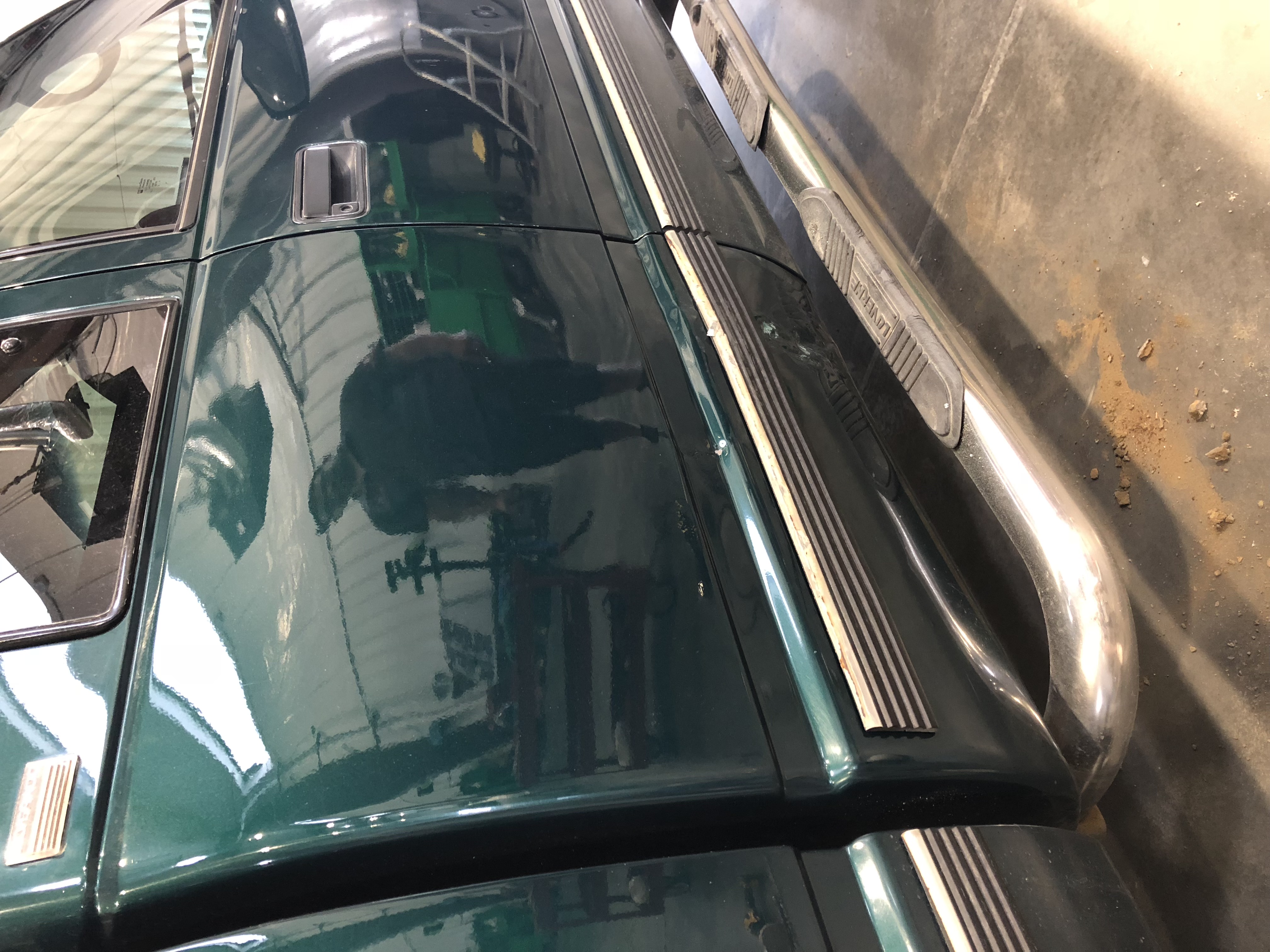 After PDR — green SUV, fully restored panel